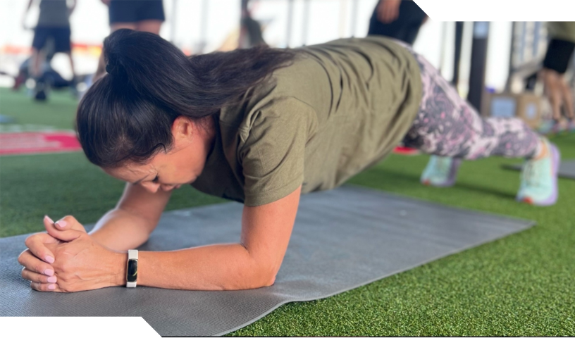 Woman stretching on yoga mat